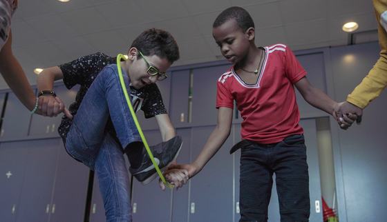 A group activity during TeamUp at School for refugee children like Mohammed_War Child_2010XX