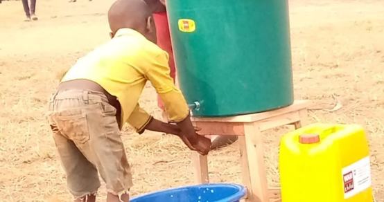 Boy in Burundi washing his hands as a precaution for COVID-19_Burundi_WarChild_Emergency Response_201007