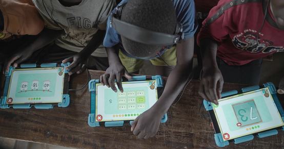 Can't Wait to Learn Uganda children on a tablet_War Child_200228