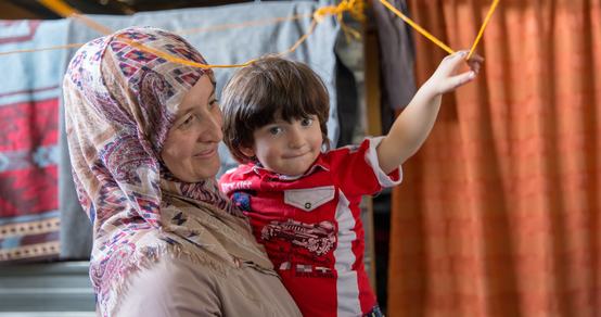 Caregiver - mother- with her child in a refugee camp in Jordan _ War Child_180424.jpg