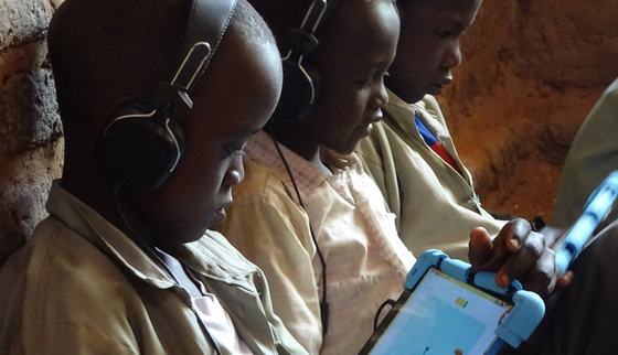 Children learning on tablets with Can't Wait to Learn_Chad_War Child_200300