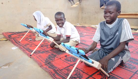 Children in Chad using War Child tablets for education_Can't Wait to Learn_Chad_War Child_200300