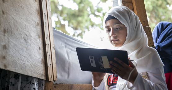 Girl Laila learns through tablet education in Lebanon_Can't Wait to Learn_War Child_200802