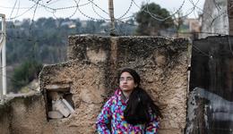 Girl standing in front of the gated walls_Hebron_OPT_War Child_191211