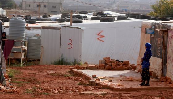 Youth walking in Bodai refugee camp_Lebanon_War Child_EASE_200514