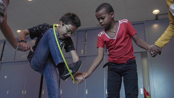 A group activity during TeamUp at School for refugee children like Mohammed_War Child_2010XX