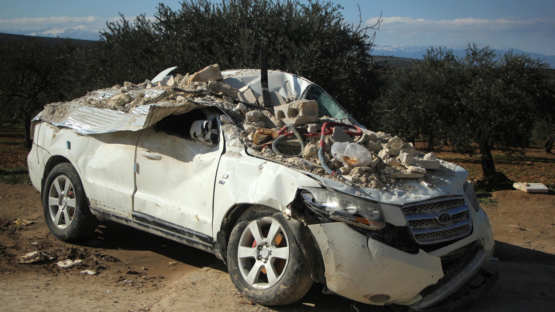 Rubbles on a car after the earthquake in Syria