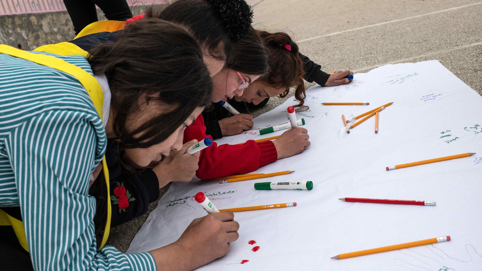 Girls drawing during TeamUP activity