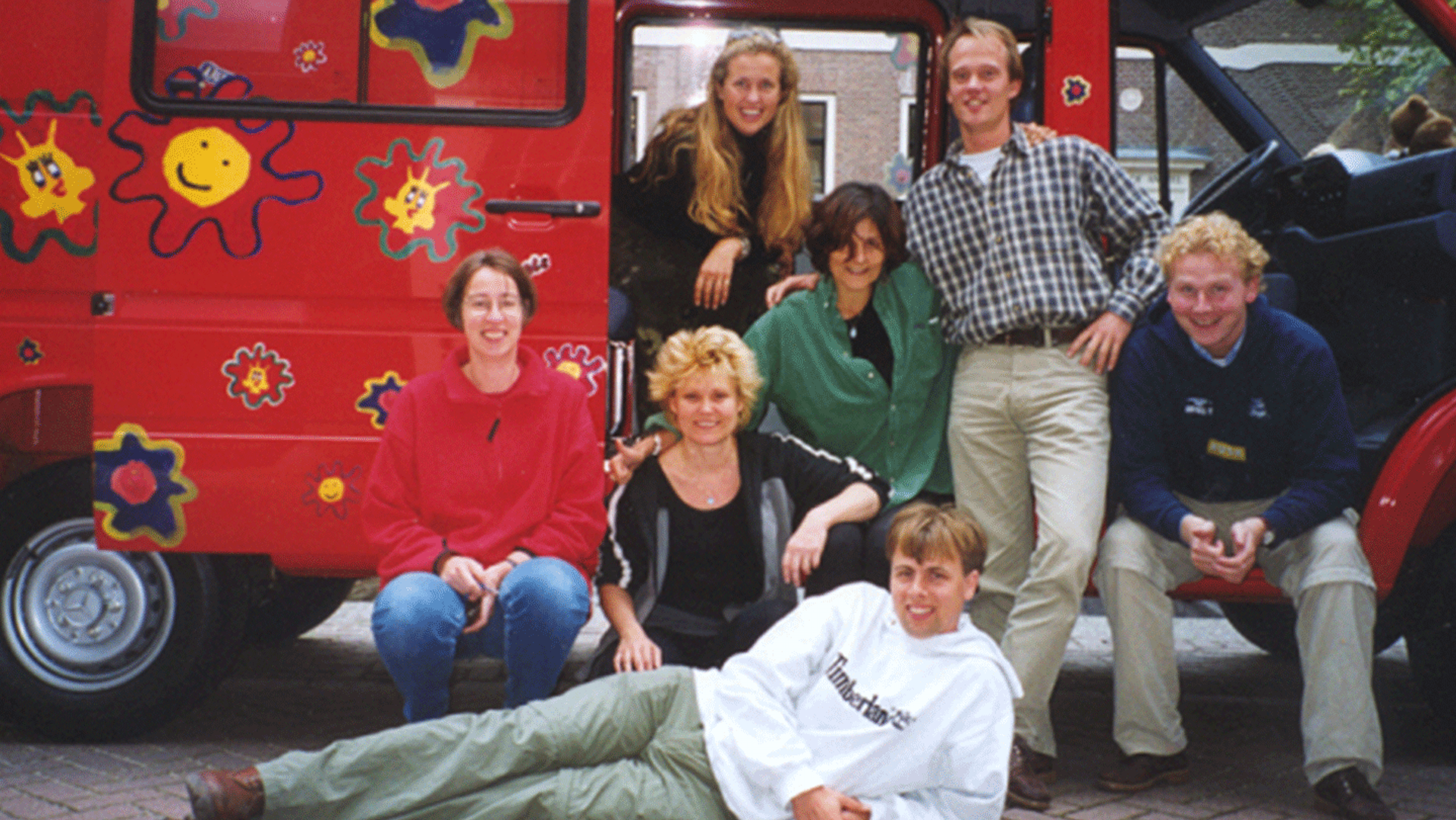 War Child historic photo archive - red fan with colleagues